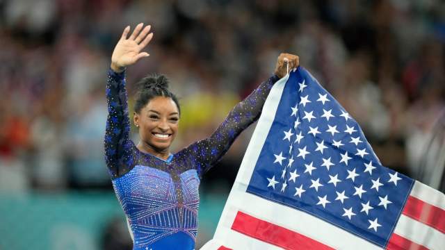 Simone Biles celebrates after winning gold in the women's gymnastics all-around during the Paris 2024 Olympic Summer Games on August 1, 2024.