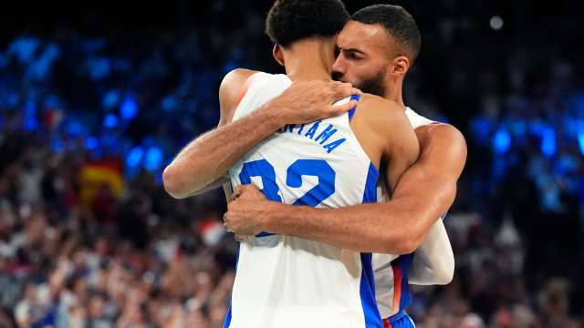 France power forward Victor Wembanyama (32) and shooting guard Evan Fournier (10) celebrate after the game against Germany in a men's basketball semifinal game during the Paris 2024 Olympic Summer Games at Accor Arena.