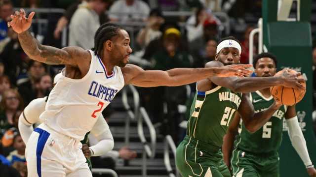 Mar 4, 2024; Milwaukee, Wisconsin, USA; Los Angeles Clippers forward Kawhi Leonard (2) tries to steal the ball from Milwaukee Bucks guard Patrick Beverley (21) in the third quarter at Fiserv Forum. Mandatory Credit: Benny Sieu-Imagn Images