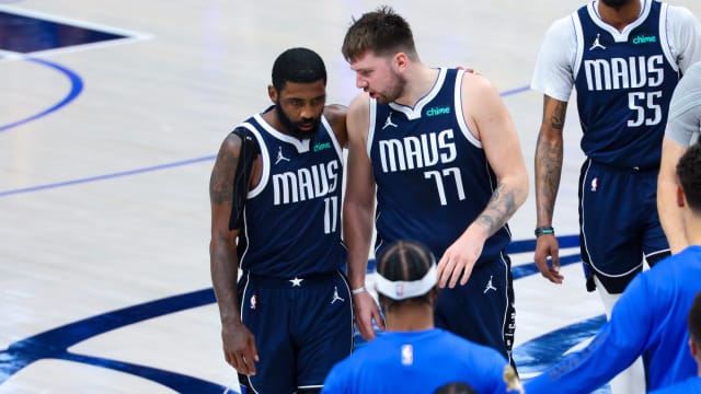 USA: Dallas Mavericks guard Kyrie Irving (11) reacts with Dallas Mavericks guard Luka Doncic (77) during the second half against the Boston Celtics during game four of the 2024 NBA Finals at American Airlines Center.