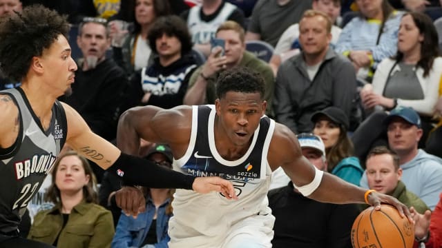 Minnesota Timberwolves guard Anthony Edwards (5) works around Brooklyn Nets forward Jalen Wilson (22) in the third quarter at Target Center.