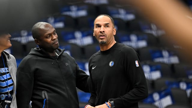 Dallas Mavericks general manager Nico Harrison (right) looks on during warms up before the game between the Dallas Mavericks and the Memphis Grizzlies at the American Airlines Center.