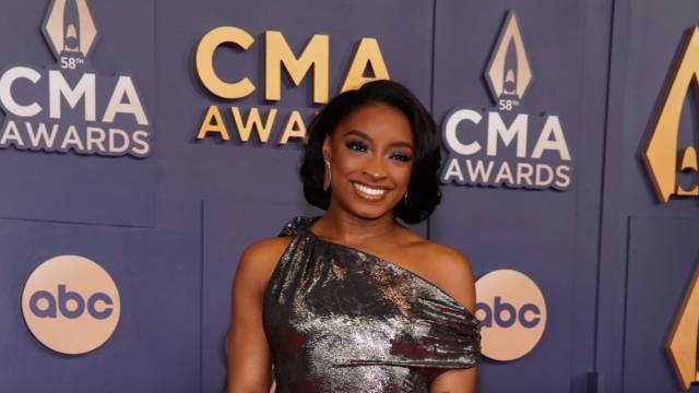 Simone Biles poses on the red carpet before the 58th Annual Country Music Association Awards in Nashville, Tenn., Wednesday, Nov. 20, 2024.  