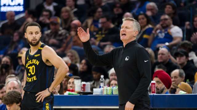 Golden State Warriors guard Stephen Curry and coach Steve Kerr at Chase Center.