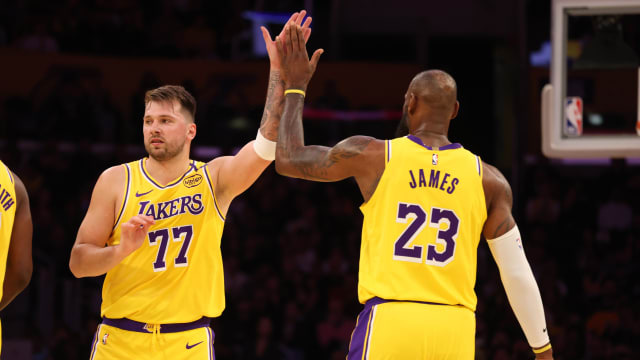 Los Angeles Lakers forward LeBron James (23) and guard Luka Doncic (77)