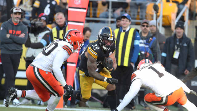 Dec 8, 2024; Pittsburgh, Pennsylvania, USA; Pittsburgh Steelers running back Jaylen Warren (30) runs after catch against Cleveland Browns linebacker Devin Bush (30) and safety Juan Thornhill (1) during the third quarter at Acrisure Stadium.