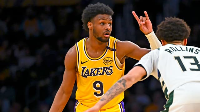 Los Angeles Lakers guard Bronny James (9) looks to pass against Milwaukee Bucks guard Ryan Rollins (13) during the second half at Crypto.com Arena.