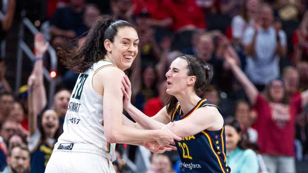 Indiana Fever guard Caitlin Clark (22) and New York Liberty forward Breanna Stewart (30).