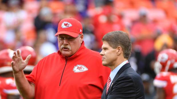 Kansas City Chiefs head coach Andy Reid talks with chairman Clark Hunt.