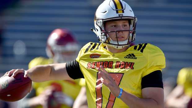 North Squad quarterback Josh Allen of Wyoming (17) throws a pass on the run during Senior Bowl practice at Ladd-Peebles Stadium.