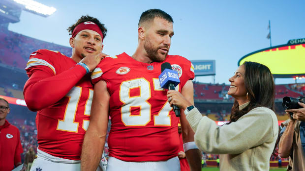 Kansas City Chiefs quarterback Patrick Mahomes (15) joins tight end Travis Kelce (87).