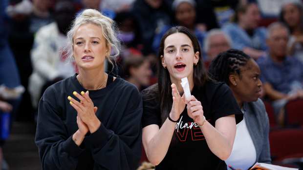 Indiana Fever guard Sophie Cunningham (8) and guard Caitlin Clark (22).