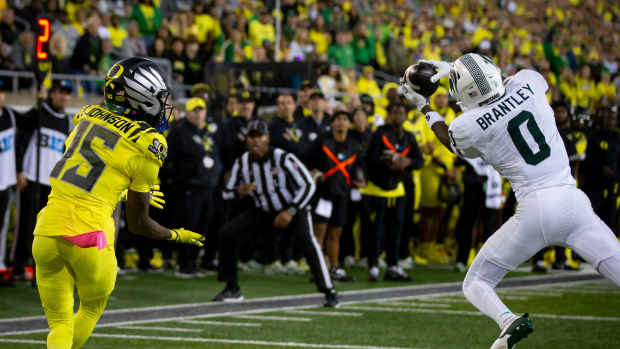 Michigan State Spartans defensive back Charles Brantley intercepts a pass intended for Oregon Ducks wide receiver Tez Johnson as the Ducks host the Spartans Friday, Oct. 4, 2024 at Autzen Stadium in Eugene, Ore.