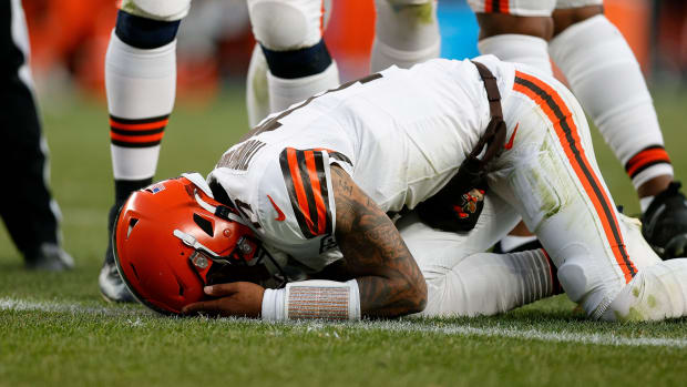 Nov 26, 2023; Denver, Colorado, USA; Cleveland Browns quarterback Dorian Thompson-Robinson (17) reacts after being hit in the third quarter against the Denver Broncos at Empower Field at Mile High.