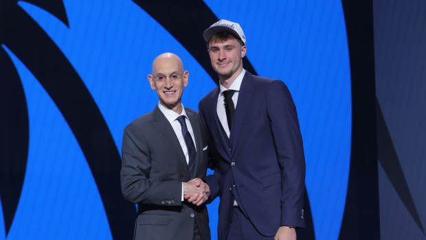 Dallas Mavericks forward Cooper Flagg poses with NBA commissioner Adam Silver.