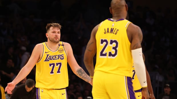 Los Angeles Lakers guard Luka Doncic (77) and forward LeBron James (23).