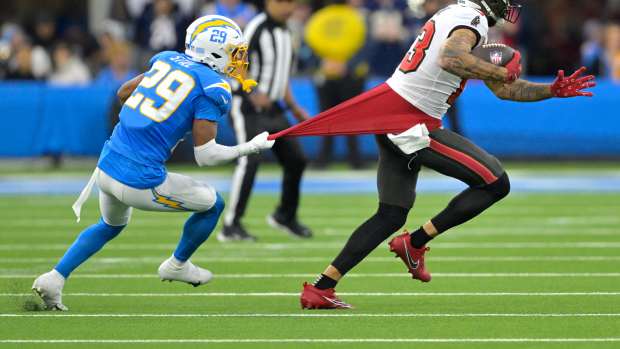 Mike Evans (13) is stopped by Tarheeb Still (29) after a complete pass.
