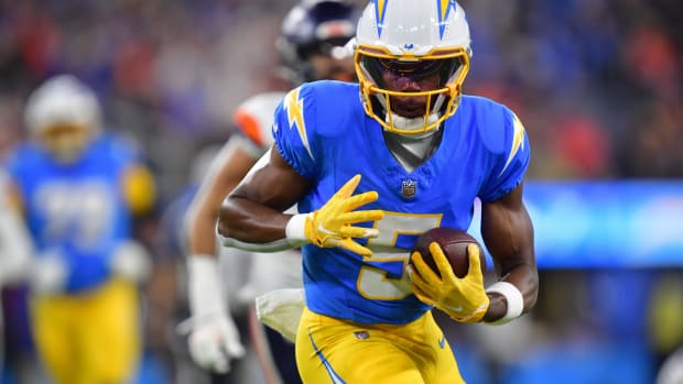 Los Angeles Chargers wide receiver Joshua Palmer (5) runs the ball against the Denver Broncos during the first half at SoFi Stadium.