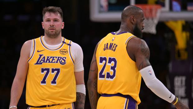 Los Angeles Lakers guard Luka Doncic (77) and forward LeBron James (23). 