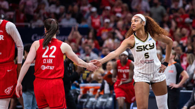 Indiana Fever guard Caitlin Clark (22) and Chicago Sky forward Angel Reese (5).