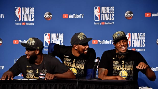 Jun 8, 2018; Cleveland, OH, USA; Golden State Warriors forward Draymond Green (23), forward Kevin Durant (35) and forward Andre Iguodala (9) speak during a press conference after beating the Cleveland Cavaliers in game four of the 2018 NBA Finals at Quicken Loans Arena. Mandatory Credit: Ken Blaze-Imagn Images