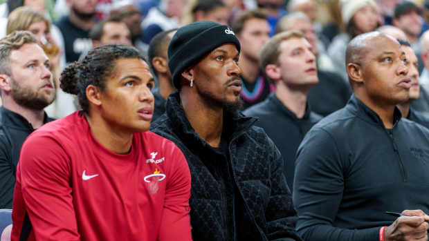 Oct 28, 2023; Minneapolis, Minnesota, USA; Miami Heat forward Jimmy Butler (22) watches play against the Minnesota Timberwolves in the first quarter at Target Center. Mandatory Credit: Matt Blewett-Imagn Images  