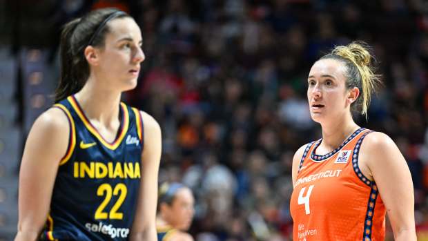 Connecticut Sun guard Marina Mabrey (4) and Indiana Fever guard Caitlin Clark (22).