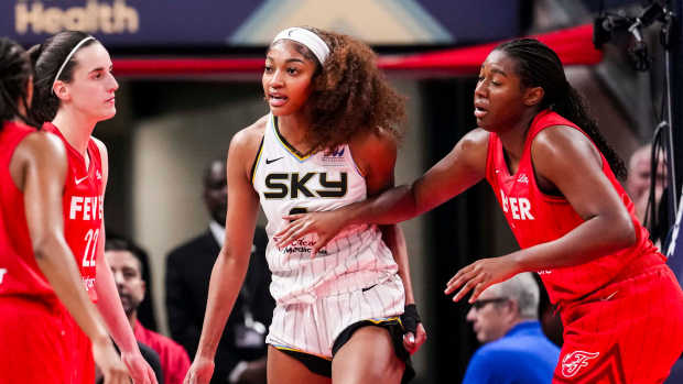 Chicago Sky forward Angel Reese (5) reacts to a flagrant foul from Indiana Fever guard Caitlin Clark (22).