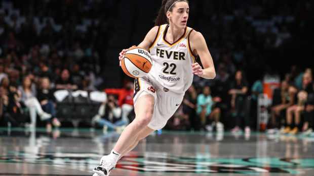 Indiana Fever guard Caitlin Clark (22) drives to the basket in the first quarter against the New York Liberty at Barclays Center. 