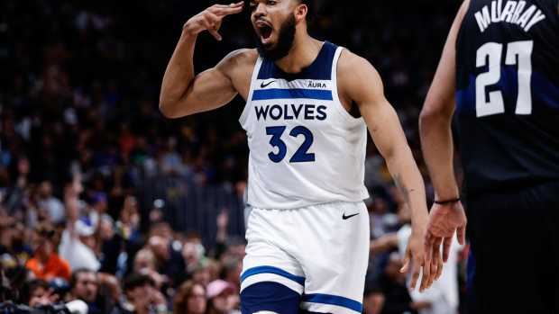 Minnesota Timberwolves center Karl-Anthony Towns (32) reacts towards the Denver Nuggets bench after a play in the second quarter during game two of the second round for the 2024 NBA playoffs at Ball Arena. 