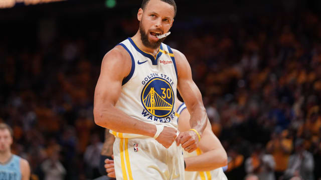 Apr 15, 2025; San Francisco, California, USA; Golden State Warriors guard Stephen Curry (30) flexes after making a free throw against the Memphis Grizzlies in the fourth quarter at the Chase Center. Mandatory Credit: Cary Edmondson-Imagn Images
