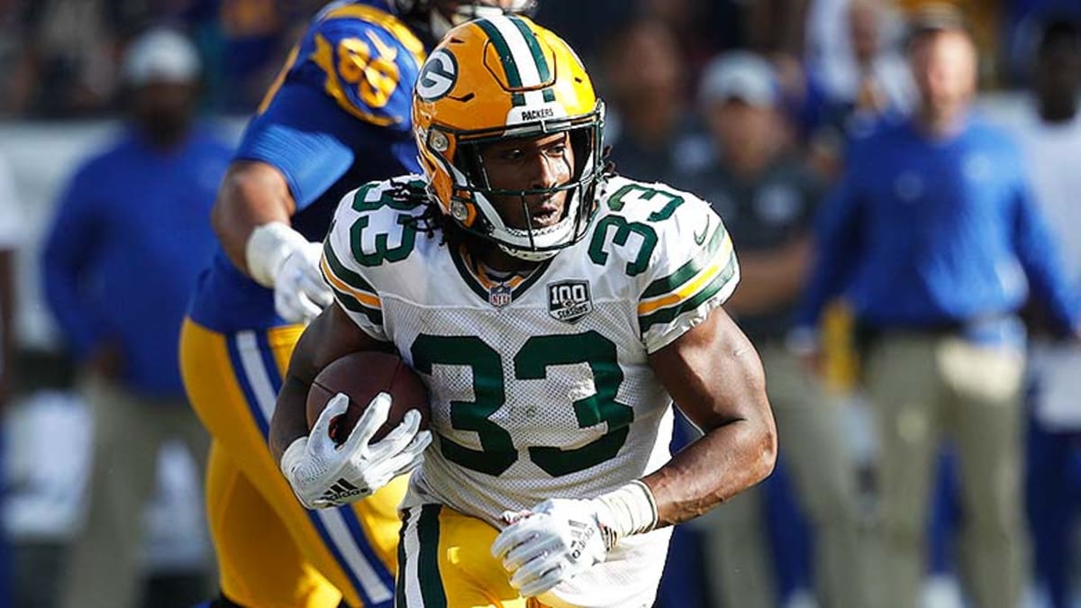 What Does Aaron Jones' Pay Cut Mean for AJ Dillon?