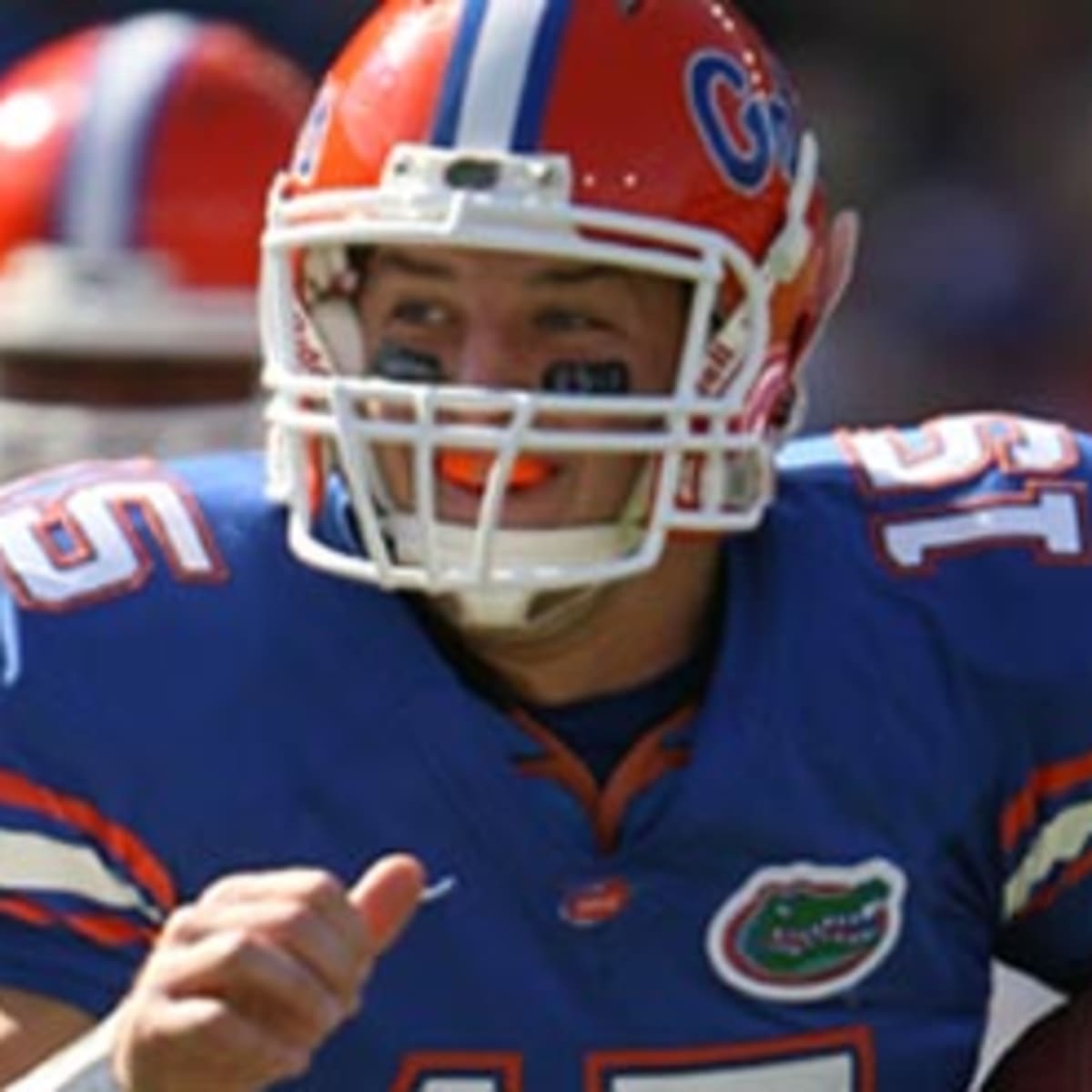 Quarterback Tim Tebow #15 of the Florida Gators rolls out against
