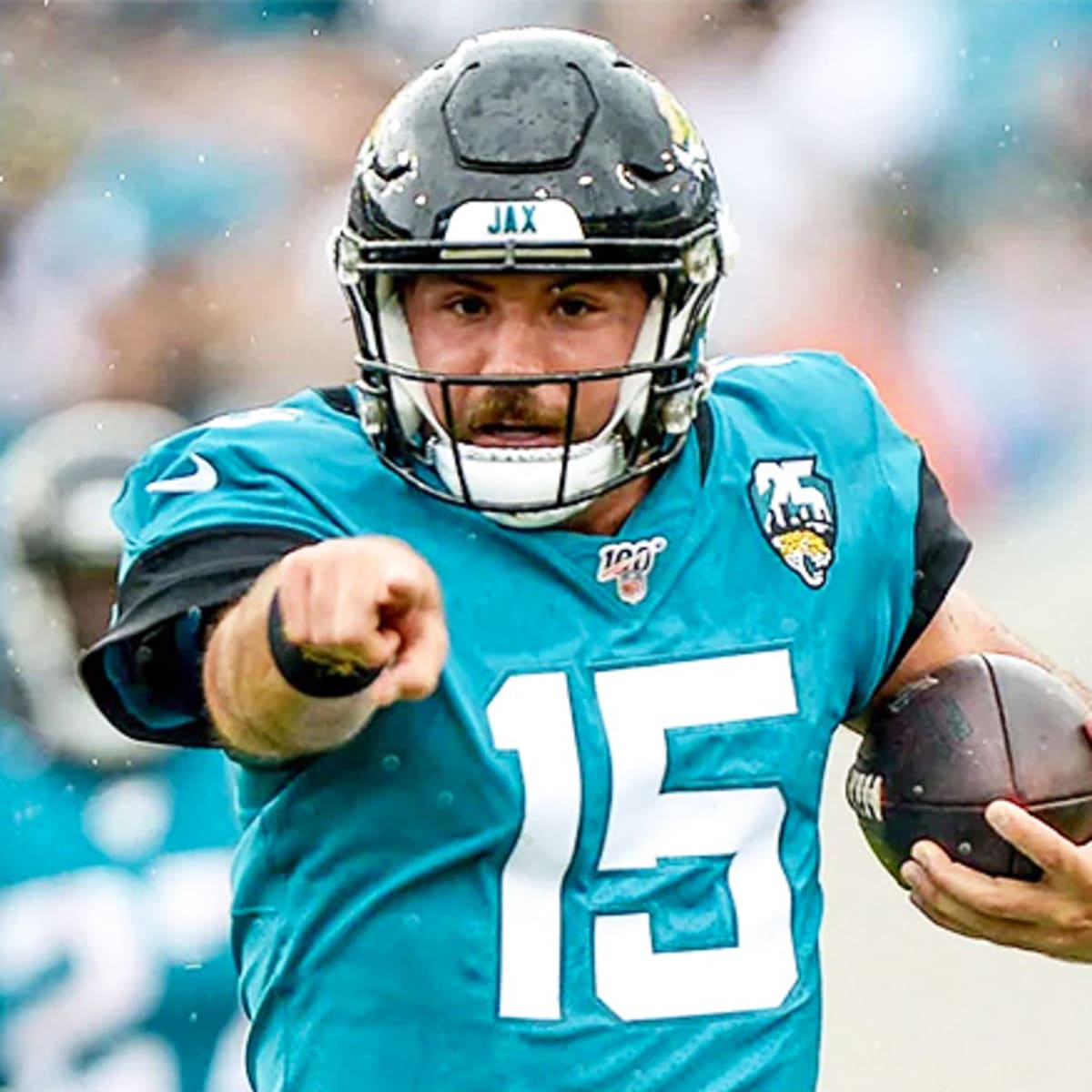 A Jacksonville Jaguars quarterback Gardner Minshew fan flexes his