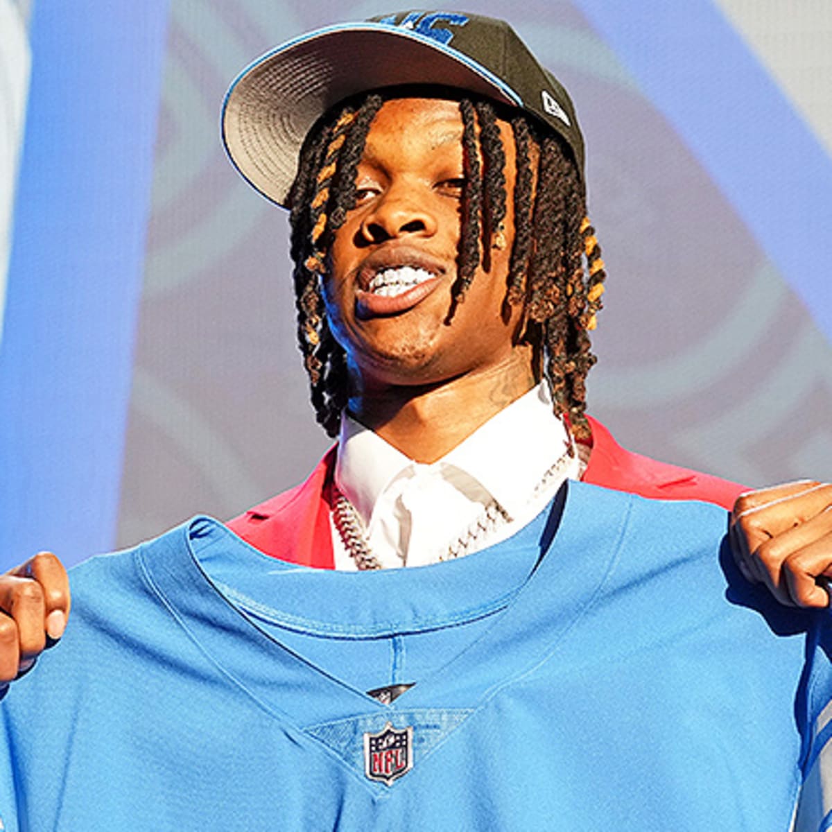 Jameson Williams flashes Skully Gang necklace medallion at NFL Draft