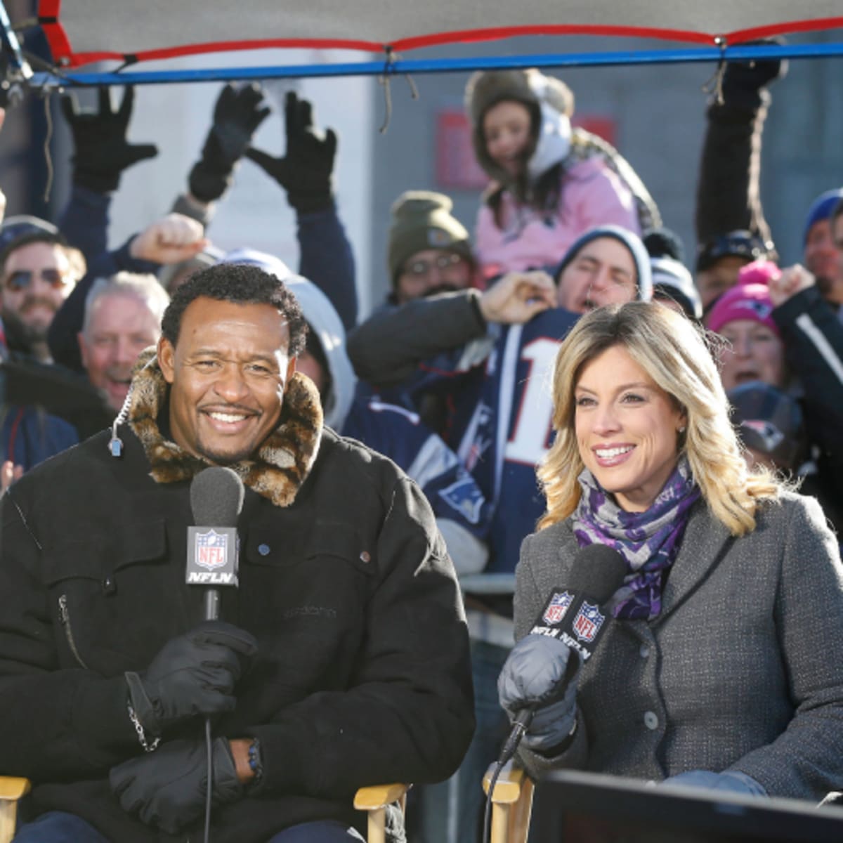 NFL Network analyst Willie McGinest, right, talks with New England