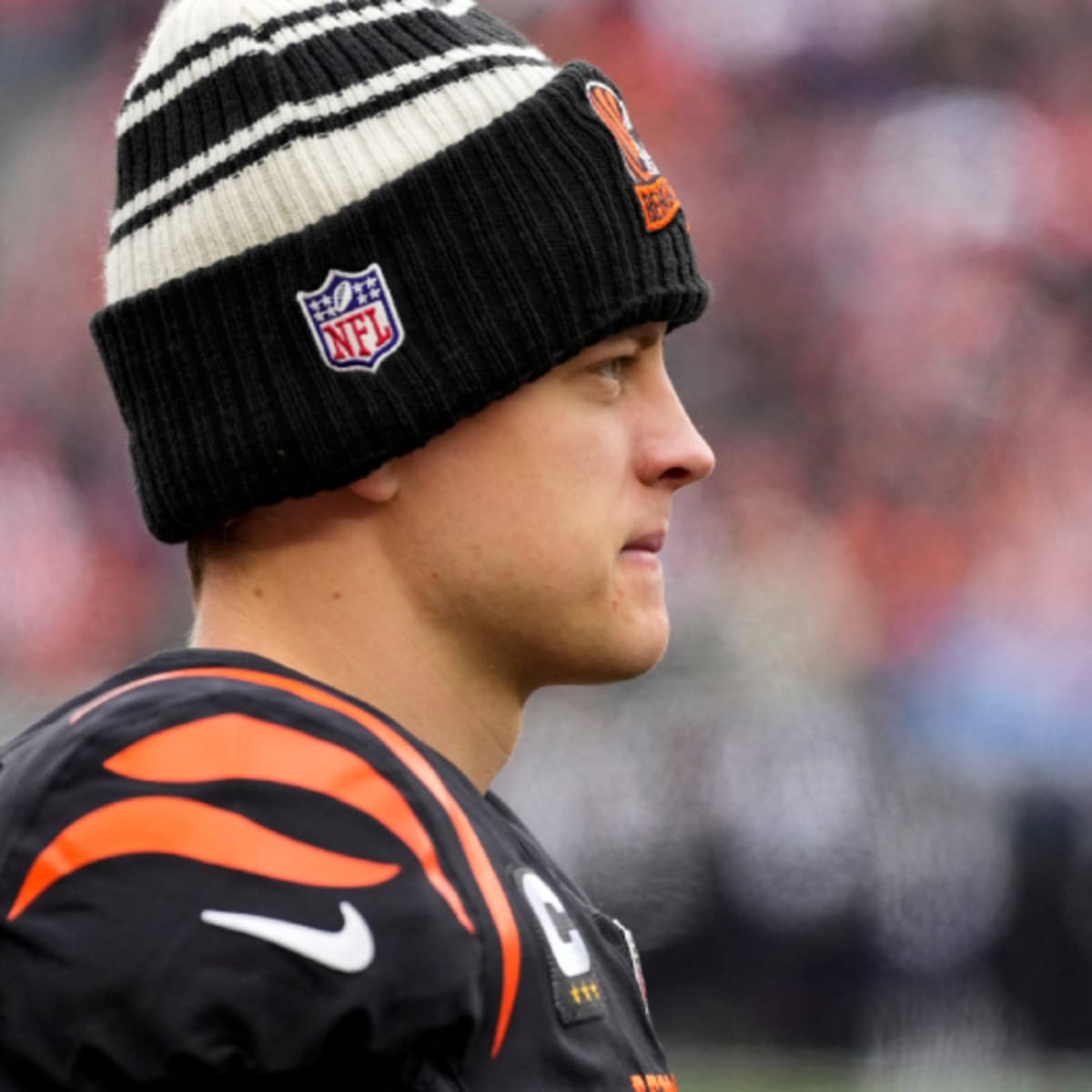 Joe Burrow is at the stand with a Santa hat,Krusty Krab shirt, and a huge  smirk : r/bengals