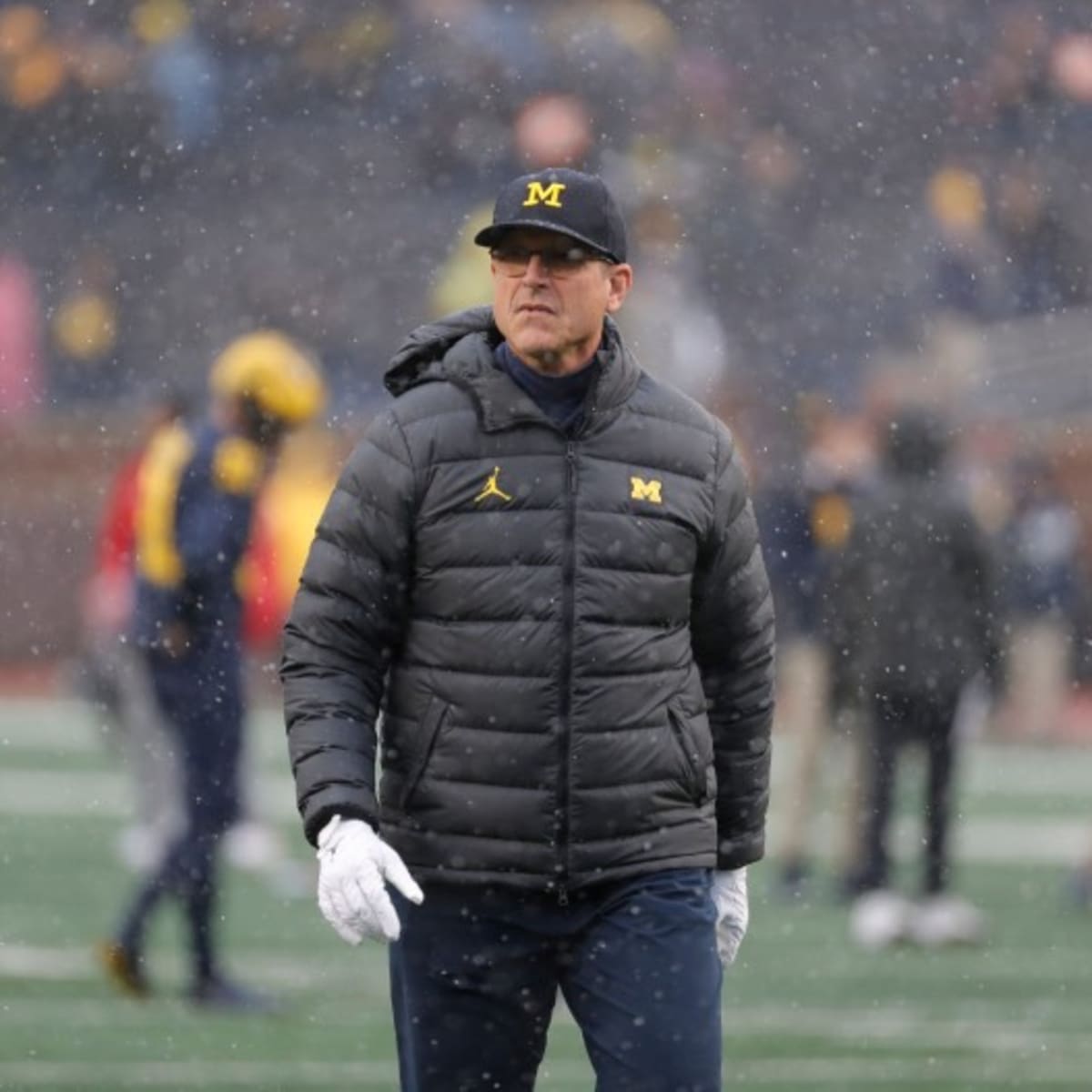 Michigan HC Jim Harbaugh and QB J.J. McCarthy talk to Allison