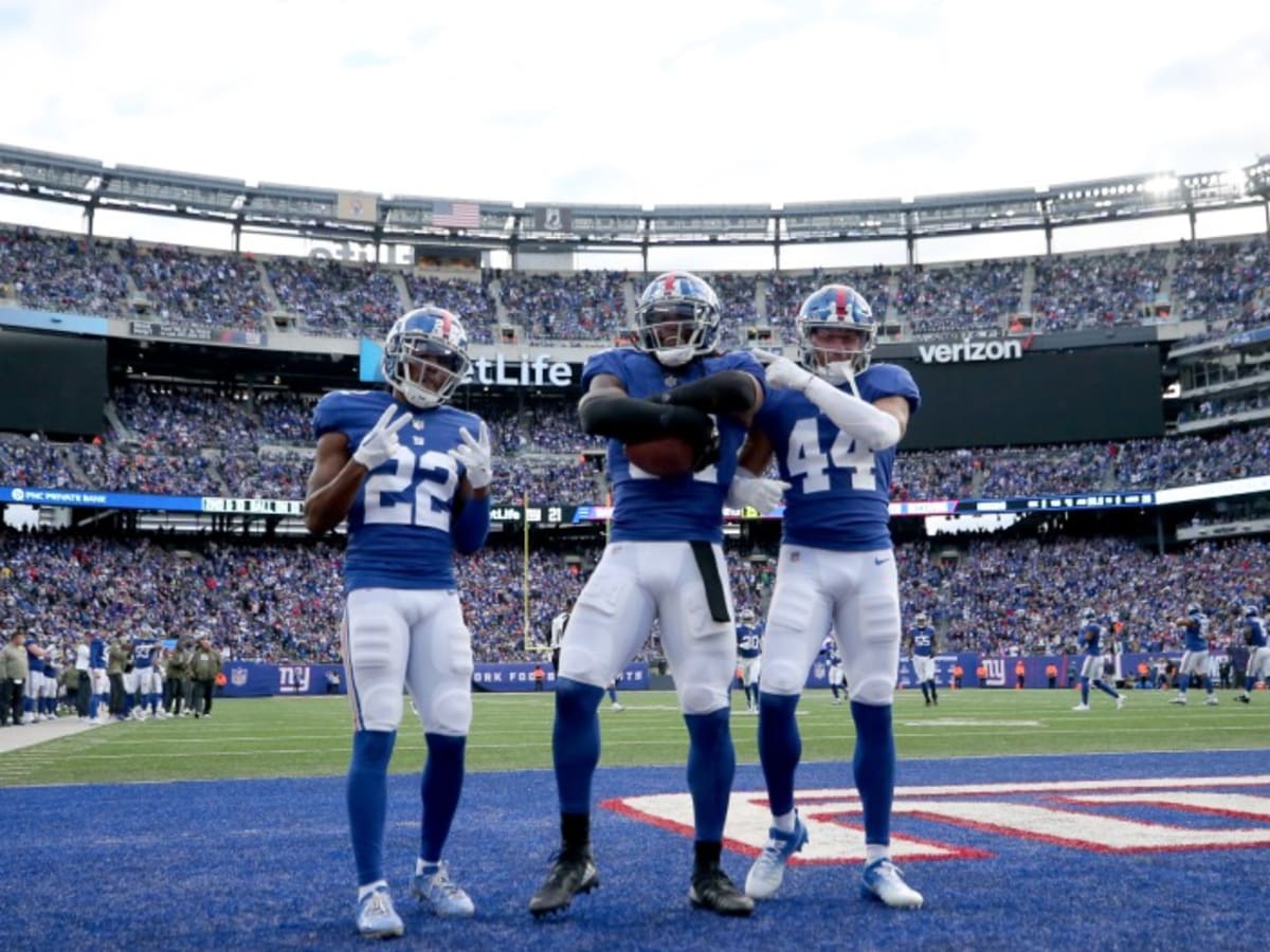 New York Giants safety Julian Love (20) wears decals of the