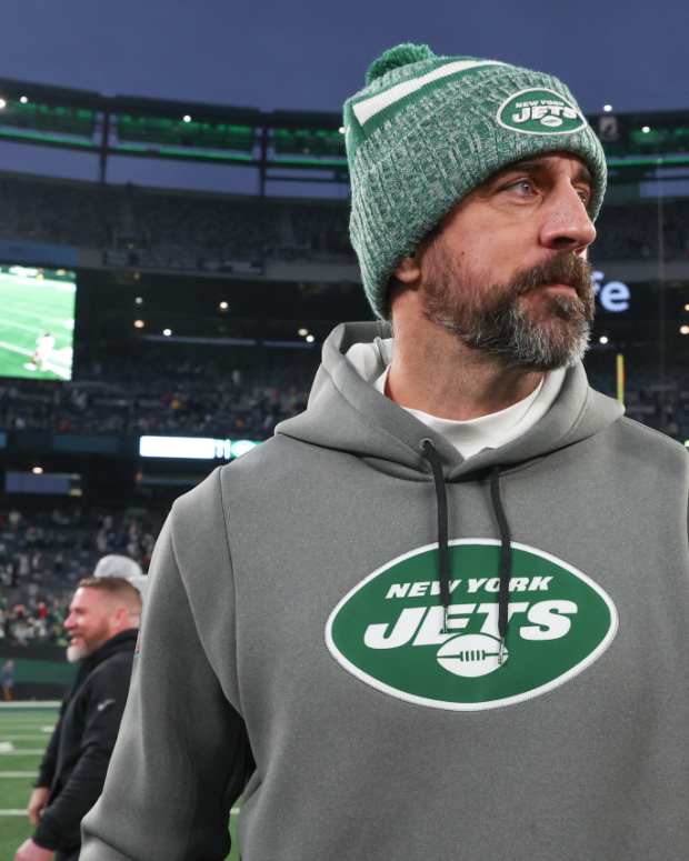  New York Jets quarterback Aaron Rodgers (8) on the field after the game against the Washington Commanders at MetLife Stadium.