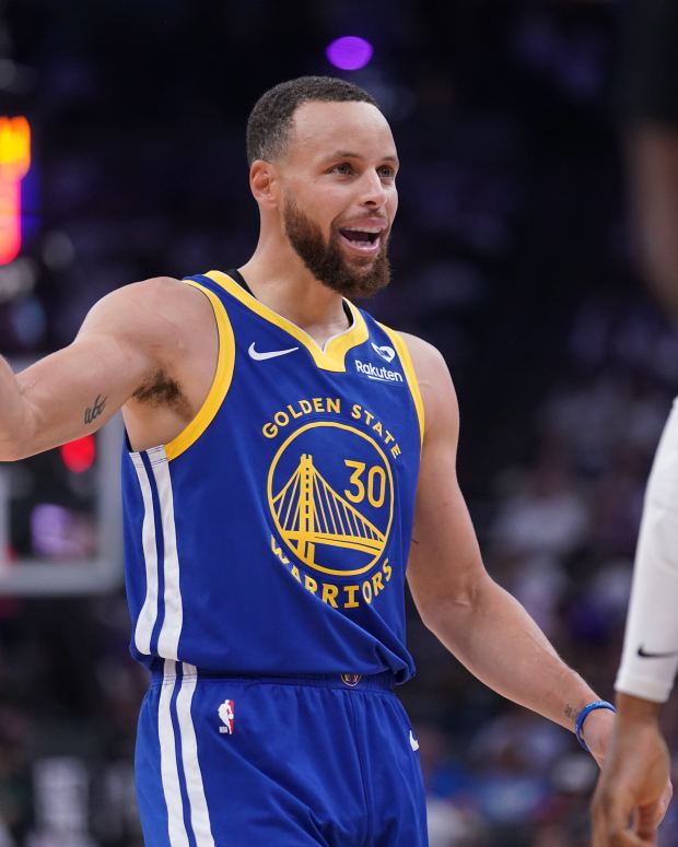Apr 16, 2024; Sacramento, California, USA; Golden State Warriors guard Stephen Curry (30) talks with teammates after a play against the Sacramento Kings in the second quarter during a play-in game of the 2024 NBA playoffs at the Golden 1 Center.