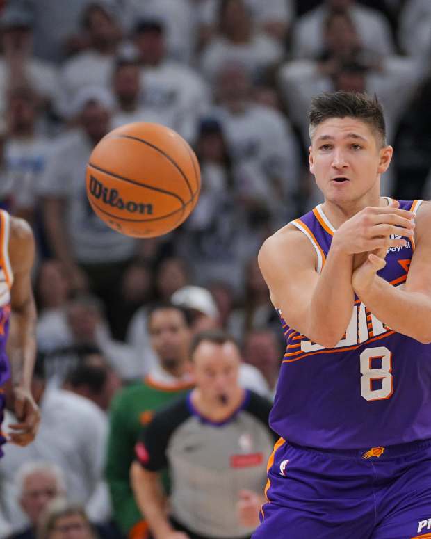 Apr 23, 2024; Minneapolis, Minnesota, USA; Phoenix Suns guard Grayson Allen (8) passes against the Minnesota Timberwolves in the second quarter during game two of the first round for the 2024 NBA playoffs at Target Center.
