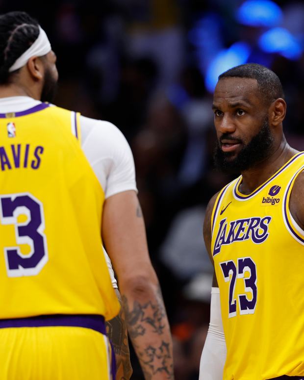 Apr 3, 2024; Washington, District of Columbia, USA; Los Angeles Lakers forward LeBron James (23) talks with Lakers forward Anthony Davis (3) against the Washington Wizards at Capital One Arena.