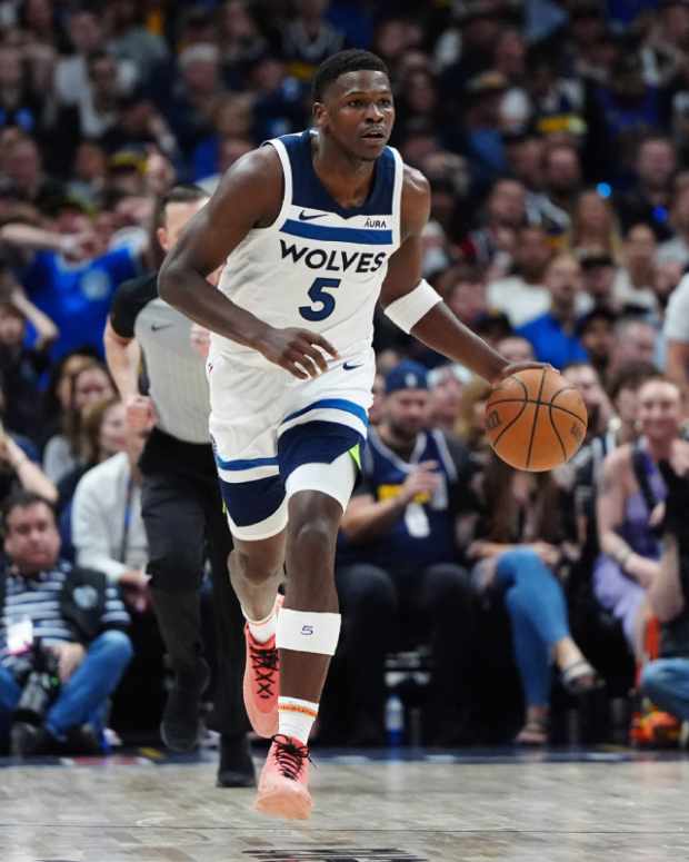 Minnesota Timberwolves guard Anthony Edwards (5) controls the ball in the second quarter against the Denver Nuggets during game one of the second round for the 2024 NBA playoffs at Ball Arena. 