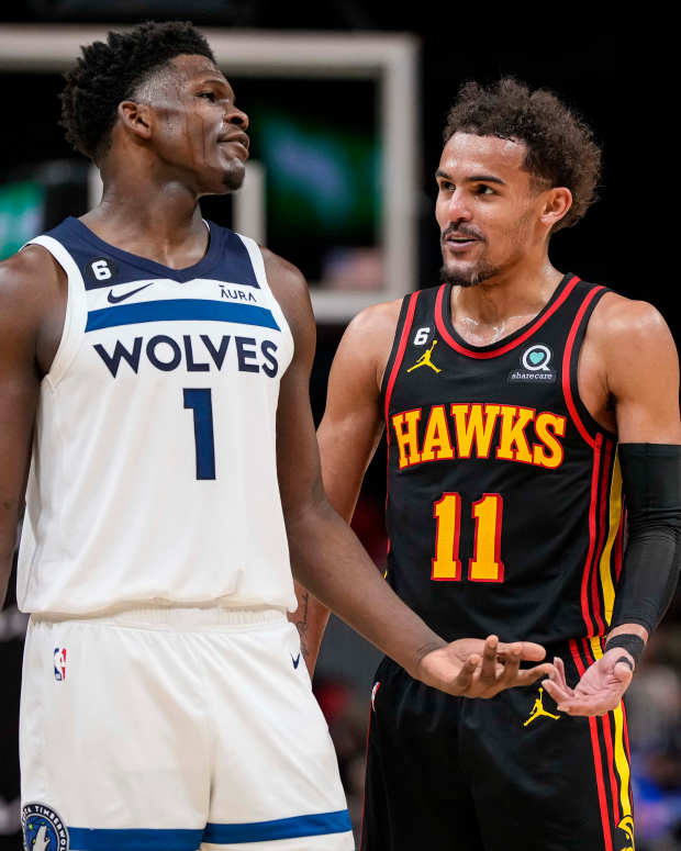 Mar 13, 2023; Atlanta, Georgia, USA; Minnesota Timberwolves guard Anthony Edwards (1) reacts with Atlanta Hawks guard Trae Young (11) during the second half at State Farm Arena.