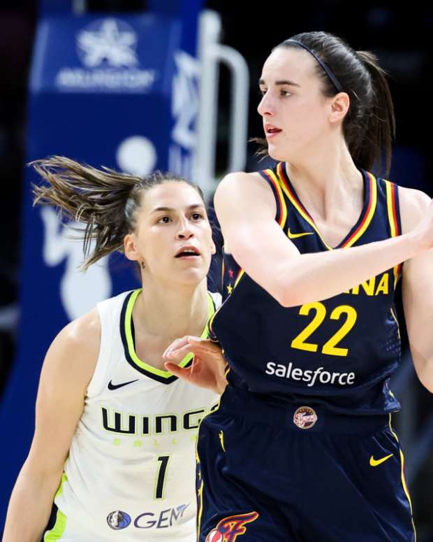 Indiana Fever guard Caitlin Clark (22) controls the ball as Dallas Wings guard Ashley Joens (1) defends during the second half at College Park Center. 