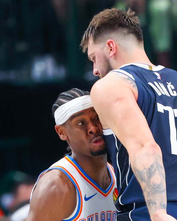 May 11, 2024; Dallas, Texas, USA; Oklahoma City Thunder guard Shai Gilgeous-Alexander (2) runs into Dallas Mavericks guard Luka Doncic (77) during the first half during game three of the second round for the 2024 NBA playoffs at American Airlines Center.