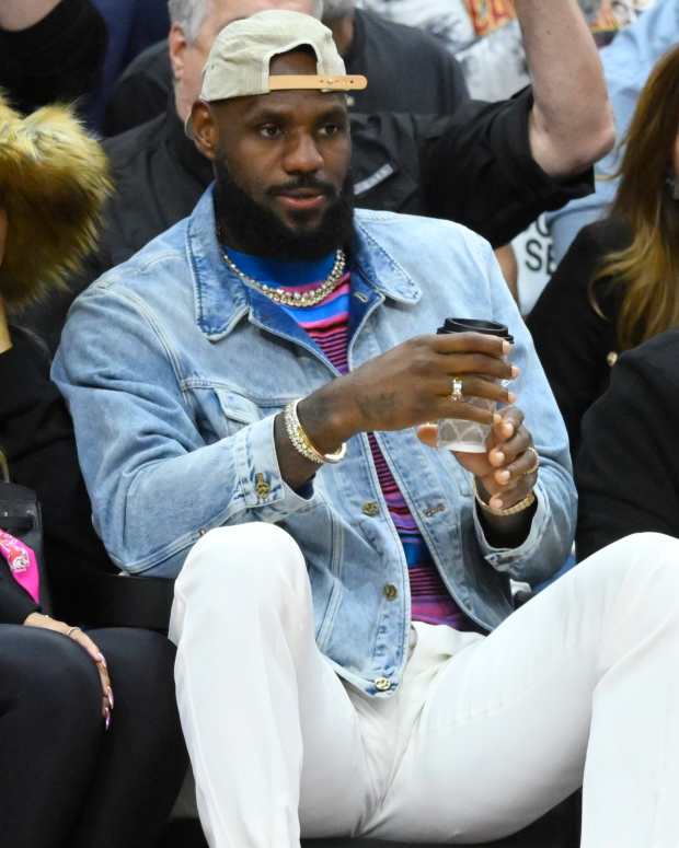 May 13, 2024; Cleveland, Ohio, USA; Savannah James, LeBron James and Rich Paul sit in the front in the fourth quarter of game four of the second round for the 2024 NBA playoffs between the Cleveland Cavaliers and the Boston Celtics at Rocket Mortgage FieldHouse.