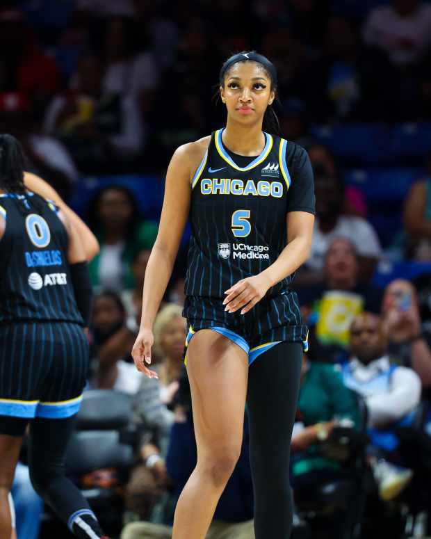 May 15, 2024; Arlington, Texas, USA; Chicago Sky forward Angel Reese (5) reacts after scoring her first point on a free throw during the first half against the Dallas Wings at College Park Center.