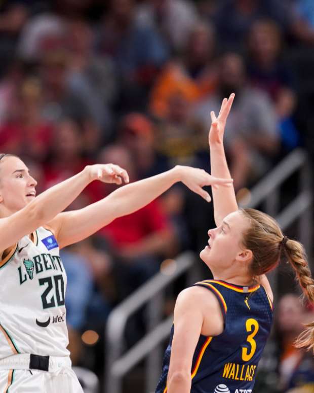 New York Liberty guard Sabrina Ionescu (20) passes the ball past Indiana Fever guard Kristy Wallace (3) on Thursday, May 16, 2024, during the Indiana Fever home opener game against the New York Liberty at Gainbridge Fieldhouse in Indianapolis.